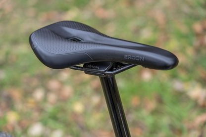 View of mountain bike seatpost on bike with saddle showing rail clamp outside