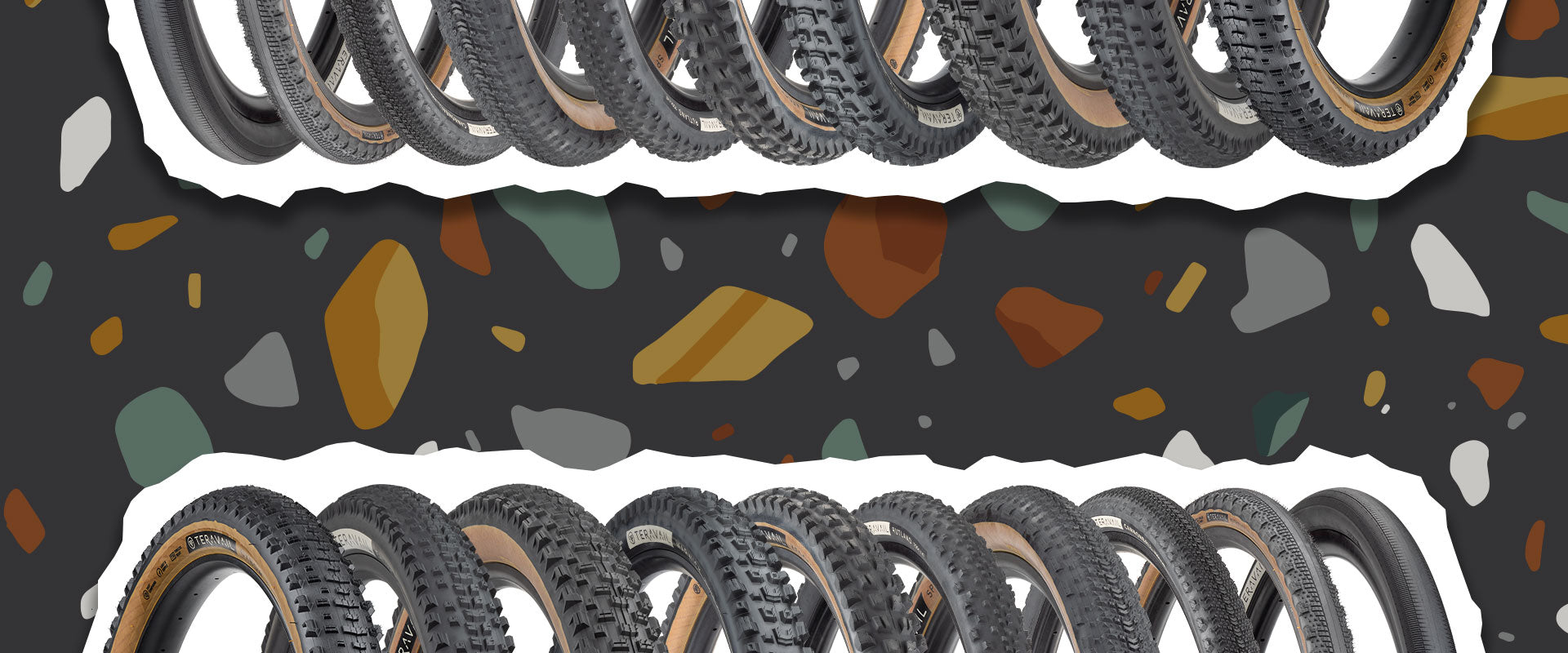 Multiple tires arranged in a row on a dark background with colorful abstract shapes.