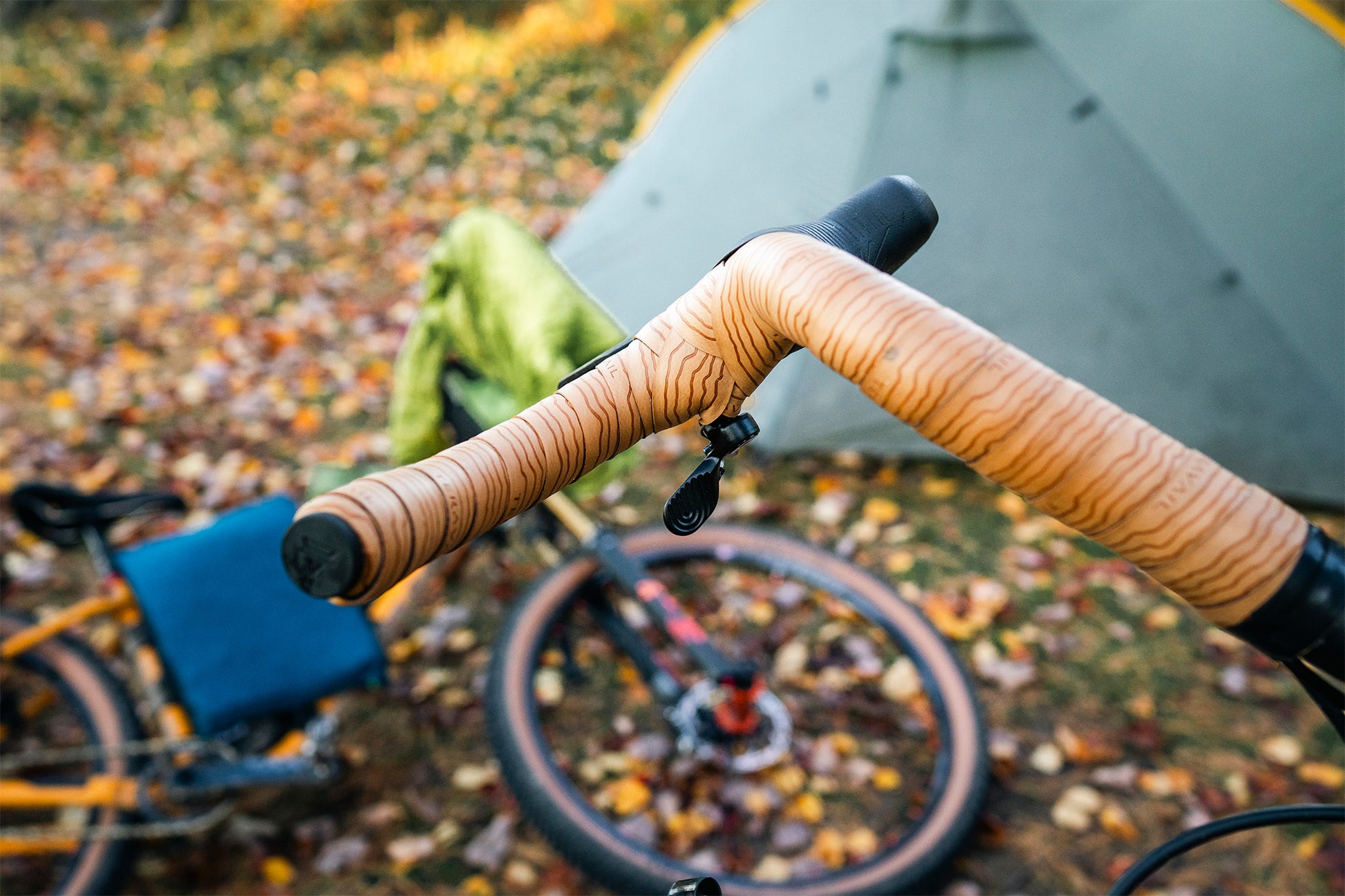 Close-up of bicycle drop handlebar on bike with dropper remote with a blurred background