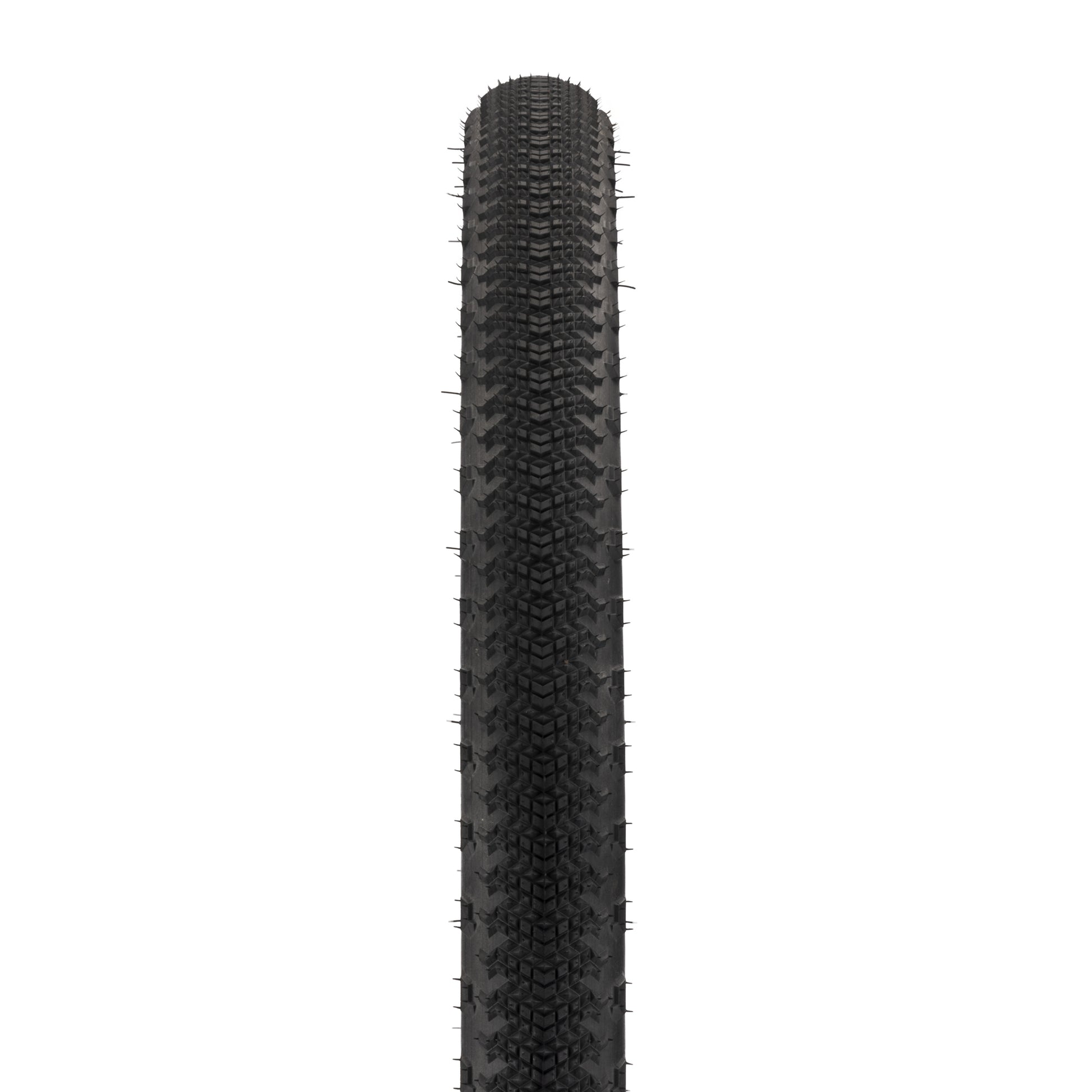 Black tire with tread pattern on a white background