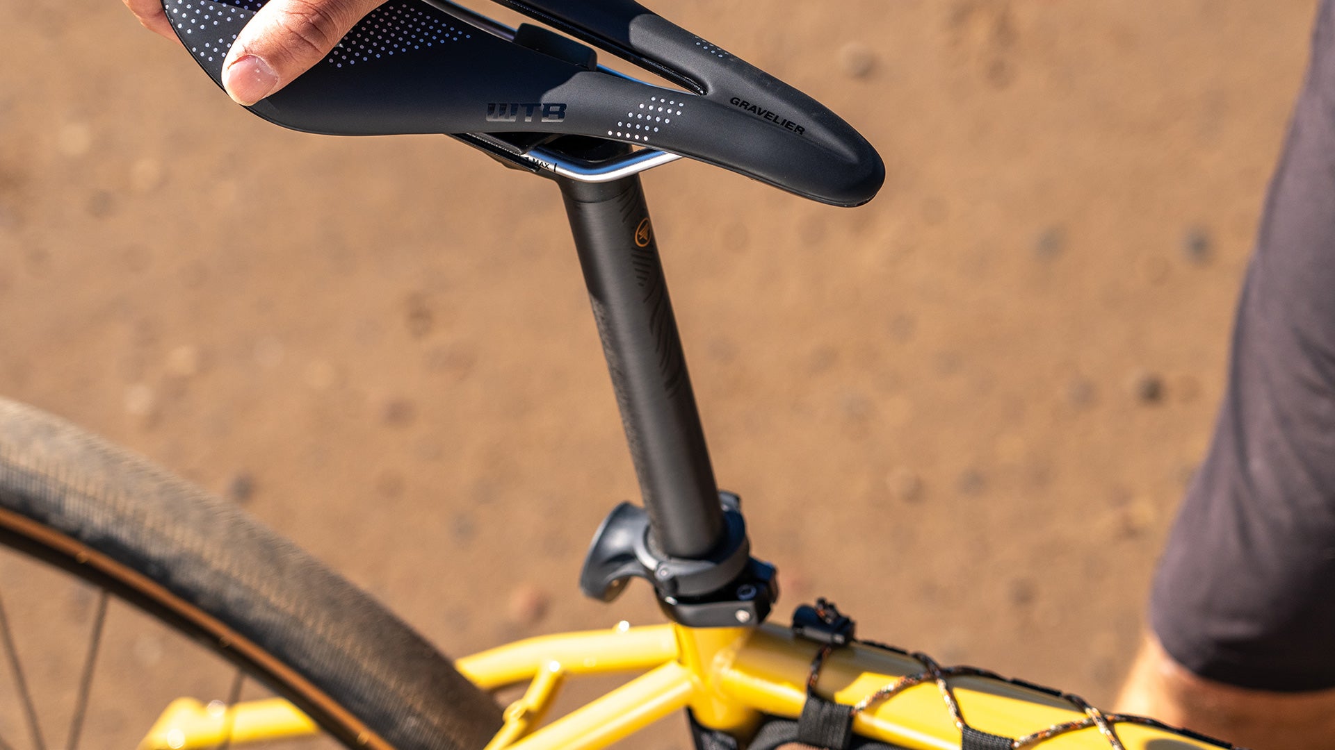 Close-up of a bicycle seat and frame with a blurred background
