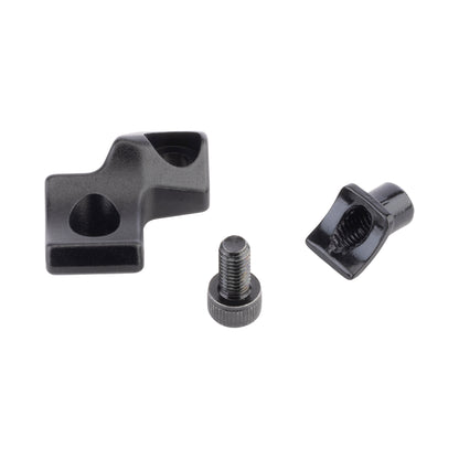 Three black metal components on a white background