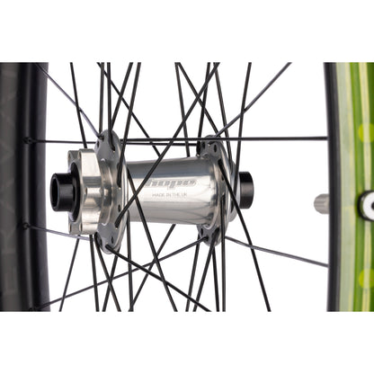 Close-up of a bicycle hub with 'Hope' branding on a white background