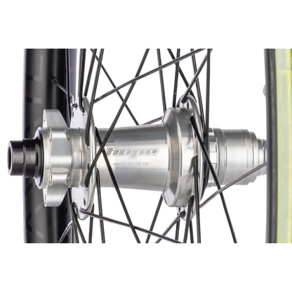 Close-up of a bicycle hub with 'hope' branding on a white background
