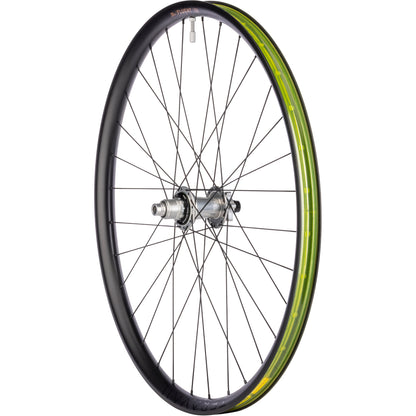 Bicycle wheel with black rim and yellow rim tape on a white background
