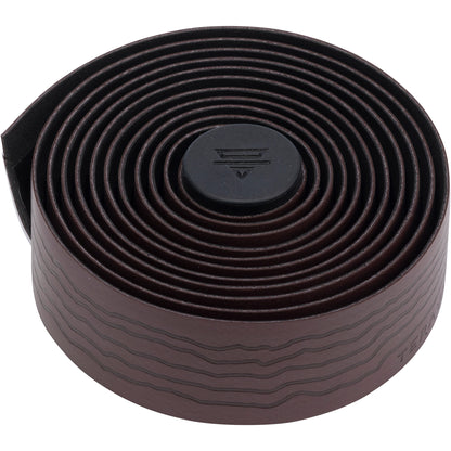 Dark red roll of Teravail bicycle handlebar tape on a white background