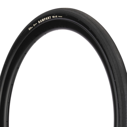 Black bicycle tire with 'Rampart' branding on a white background