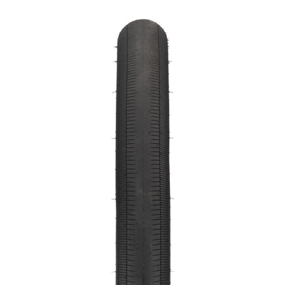 Black tire with tread pattern on a white background