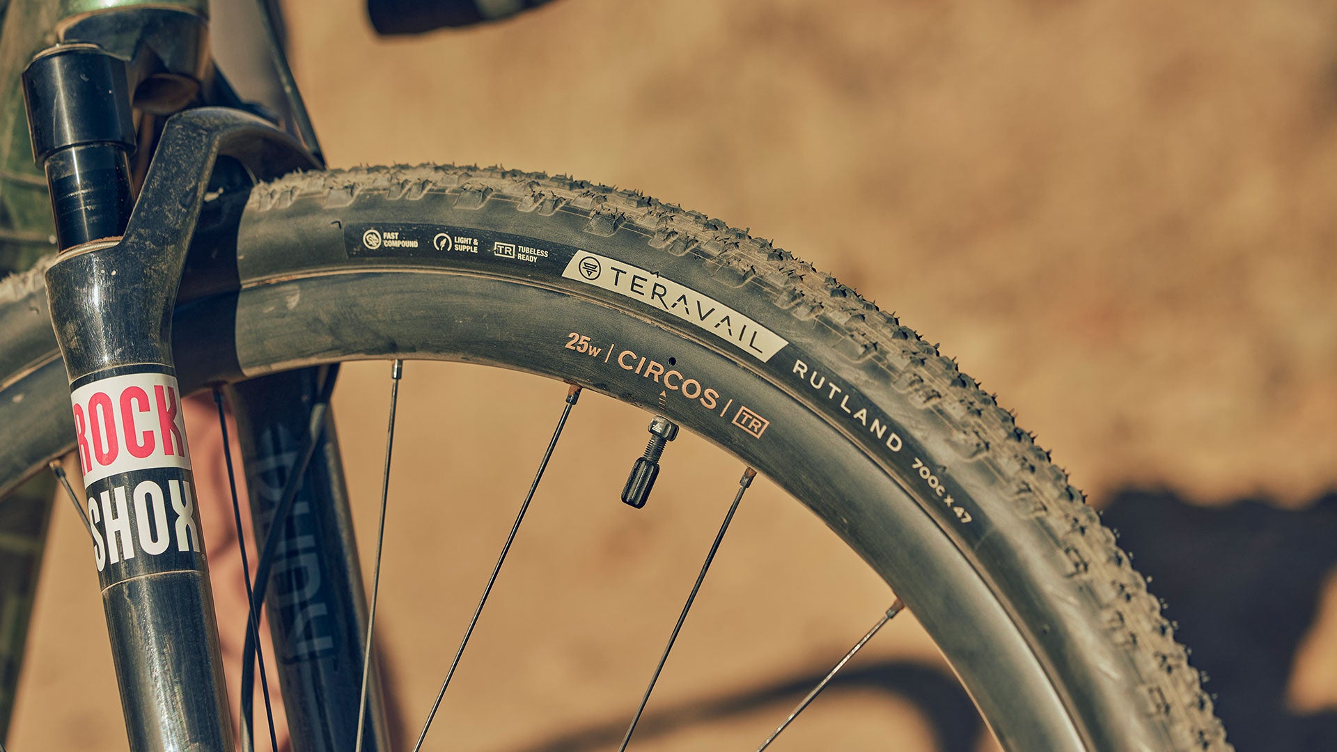 Dusty front wheel of gravel bike with Teravail Circos Carbon Rim