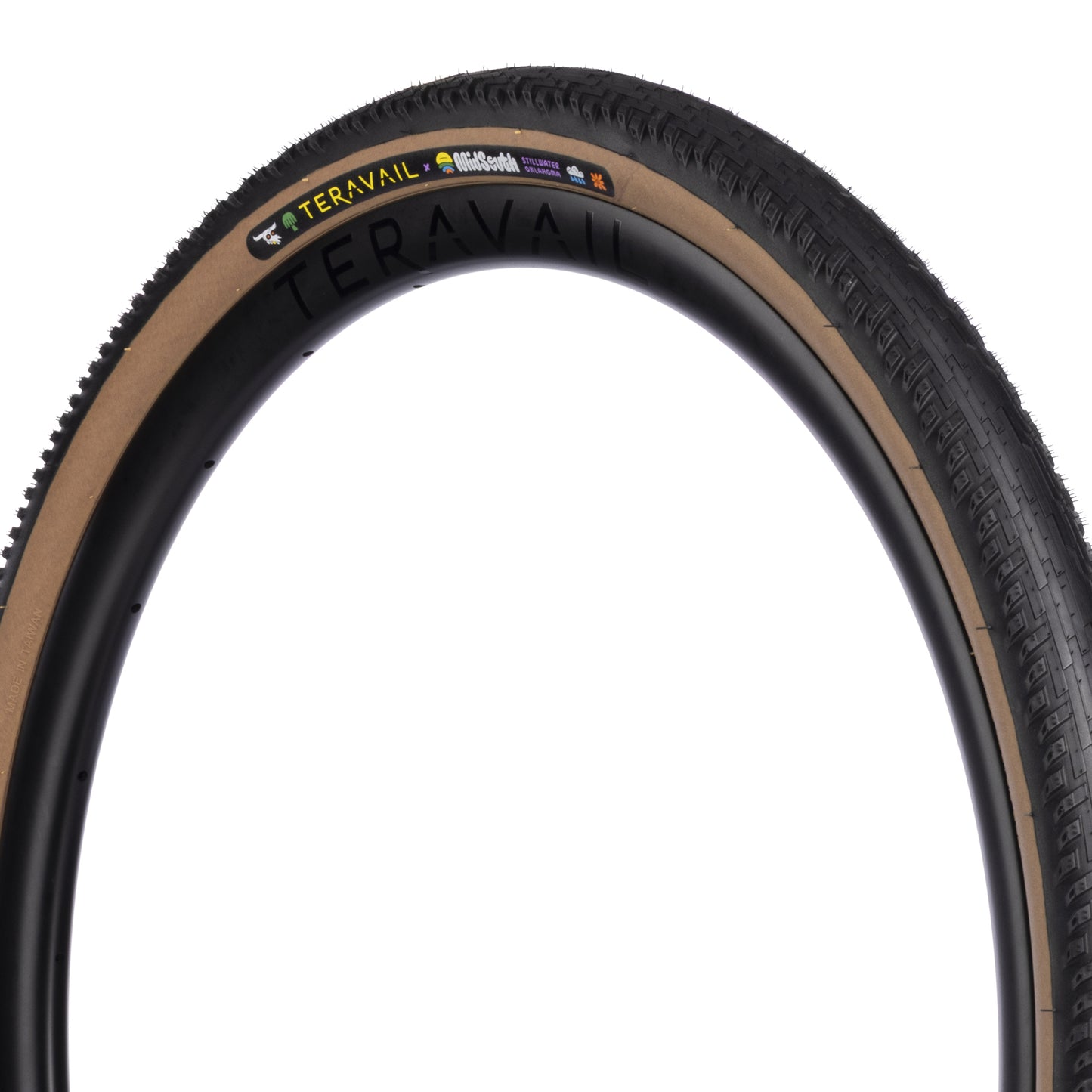 Three-quarter view of MidSouth Updraft Tire showing tan sidewall on a white background