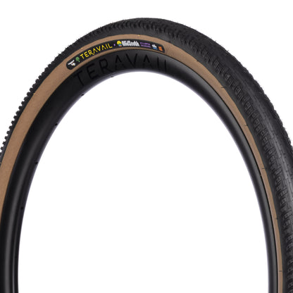 Three-quarter view of MidSouth Updraft Tire showing tan sidewall on a white background